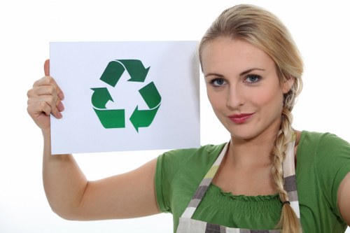 Eco-friendly waste collection vehicles navigating Central London